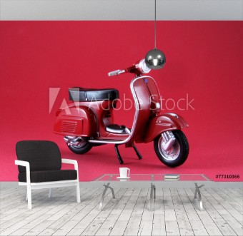 Picture of Scooter antguo rojo aislado en rojo